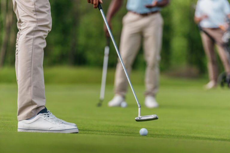 Golfer taking a putt