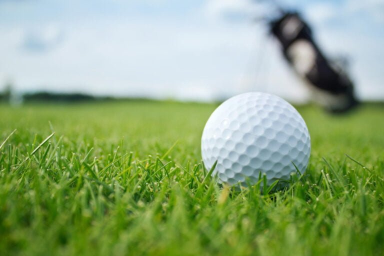 Golf ball sitting in grass
